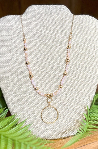 Short Beaded Necklace Featuring Twisted Metal Circle Pendant, Pink